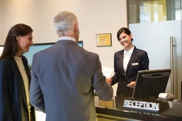 Female brand promoter engaging customer at reception for promoters agency in Dubai