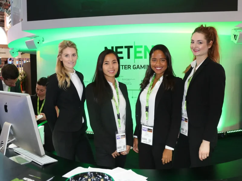 Diverse nationality event staff team at exhibition booth in Dubai