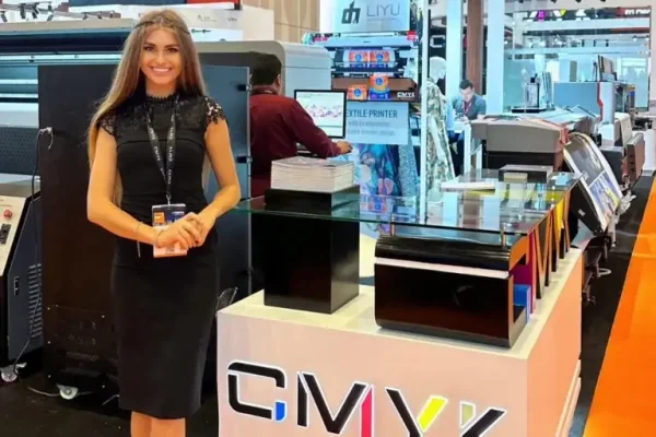 Female professional hostess representing brand at exhibition stall in Dubai