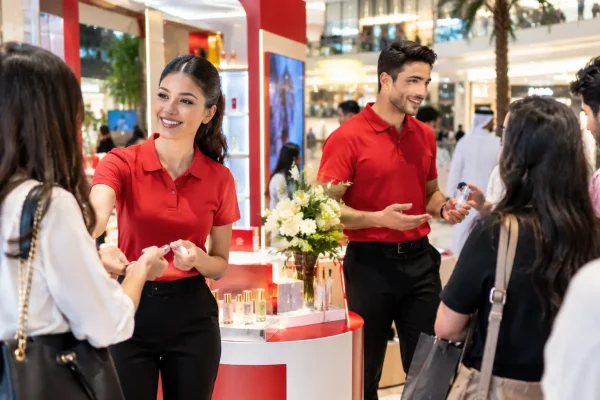Promoters and brand ambassadors engaging visitors at a Dubai event.