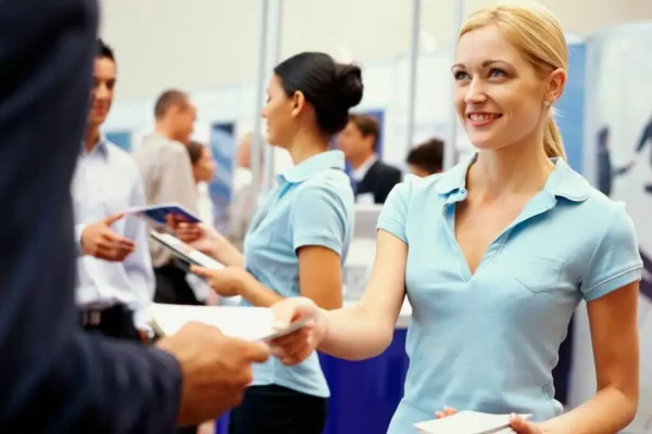 Female brand promoter engaging customer at mall activation in Dubai